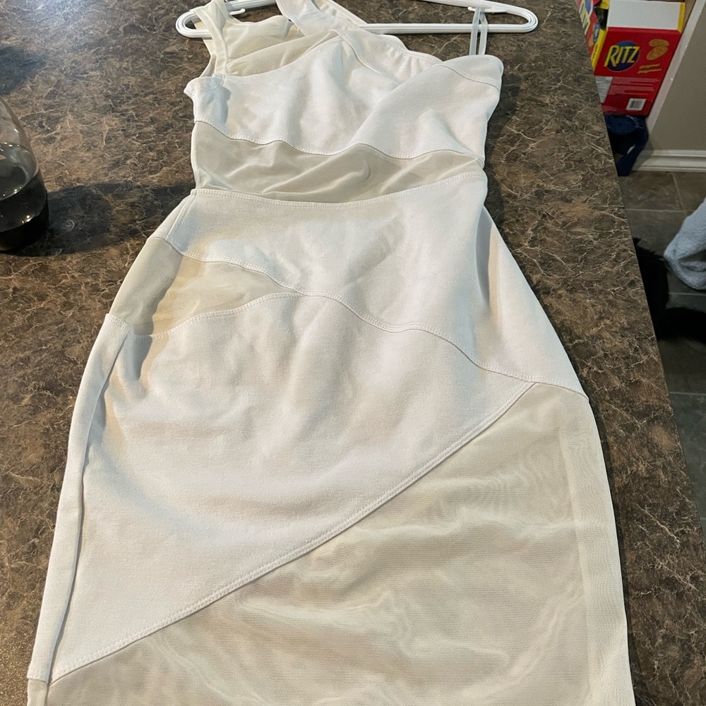 Short white dress bought for trip to Jamaica but never worn